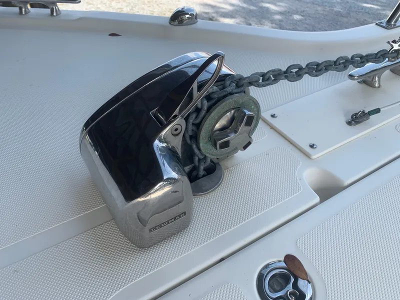 Slide: The Image of Anchor windlass on 2008 Pursuit 315 OS boat deck with chain. - 38