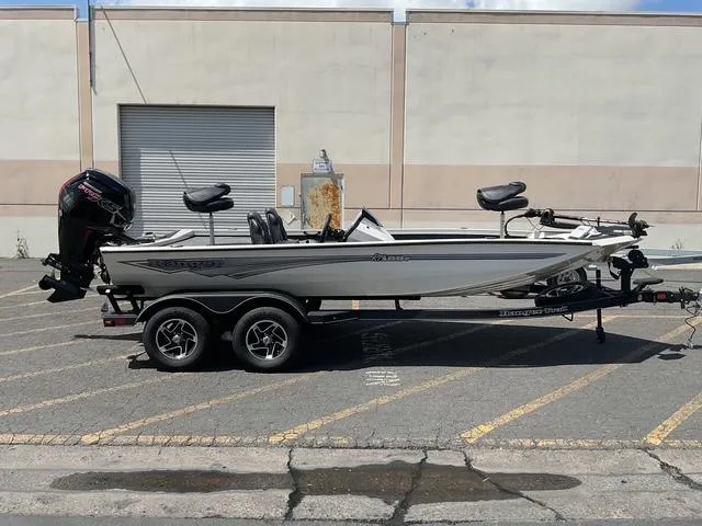 Slide: The Image of 2025 Ranger RT188P boat on trailer in parking lot, side view. - 0