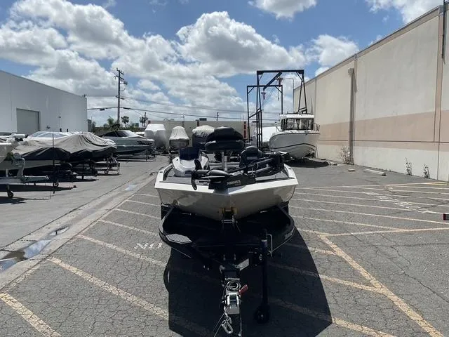 Slide: The Image of 2025 Ranger RT188P boat parked outdoors under a cloudy sky. - 4