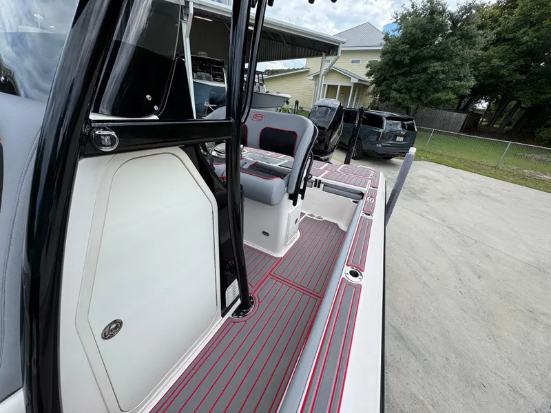 Slide: The Image of 2018 ShearWater 260 Carolina Flare boat with sleek deck design and modern seating. - 20