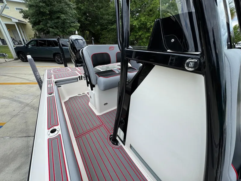 Slide: The Image of 2018 ShearWater 260 Carolina Flare boat interior with seating and deck view. - 21