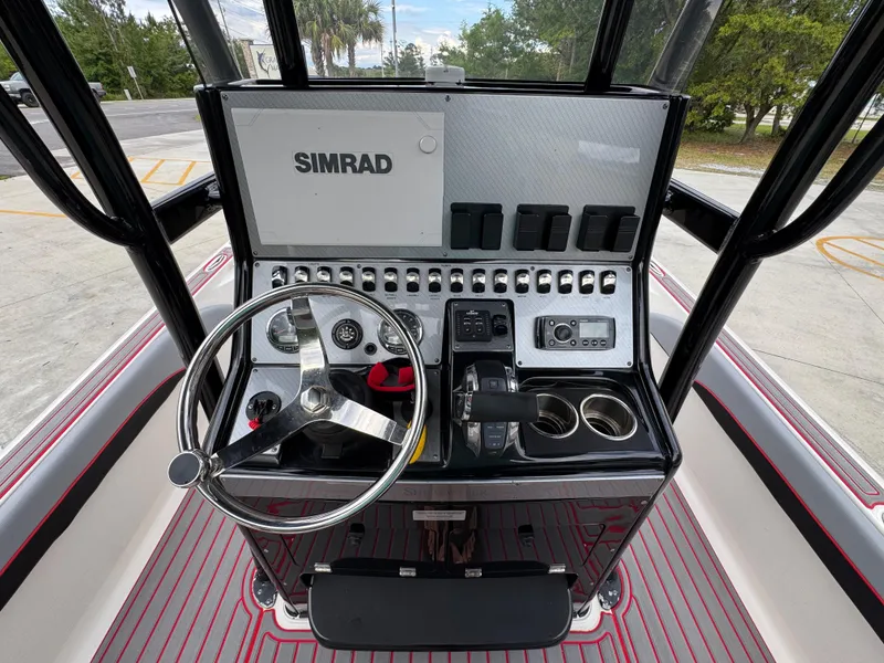 Slide: The Image of 2018 ShearWater 260 Carolina Flare boat console with Simrad navigation system. - 25