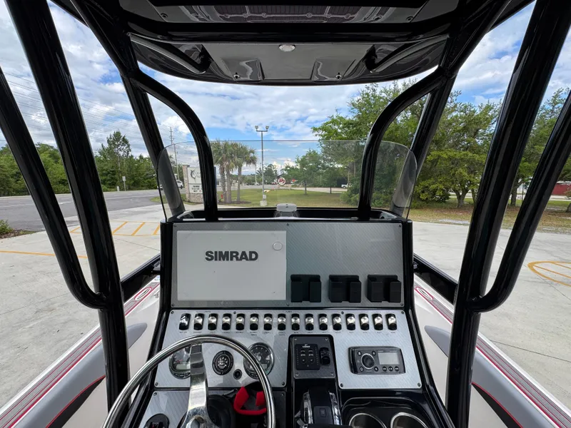 Slide: The Image of 2018 ShearWater 260 Carolina Flare boat dashboard with Simrad navigation system. - 26