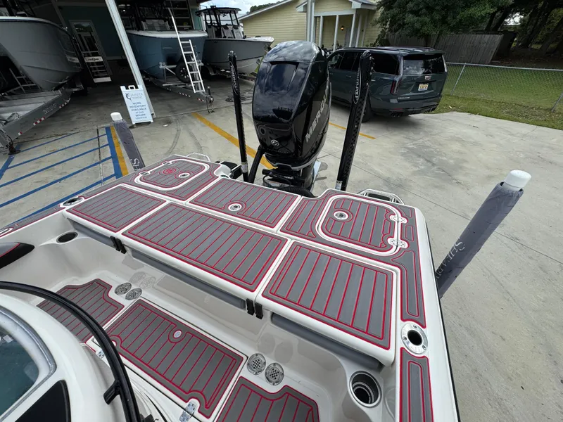 Slide: The Image of 2018 ShearWater 260 Carolina Flare boat with detailed deck and powerful outboard motor. - 29