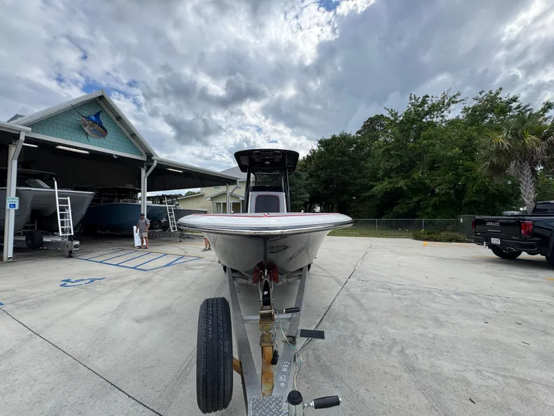 Slide: The Image of 2018 ShearWater 260 Carolina Flare boat on trailer, cloudy sky background. - 6