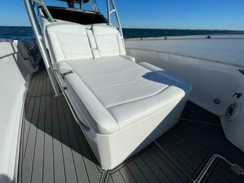Slide: The Image of 2020 Nor-Tech Center Console boat with white cushioned seating on deck. - 3