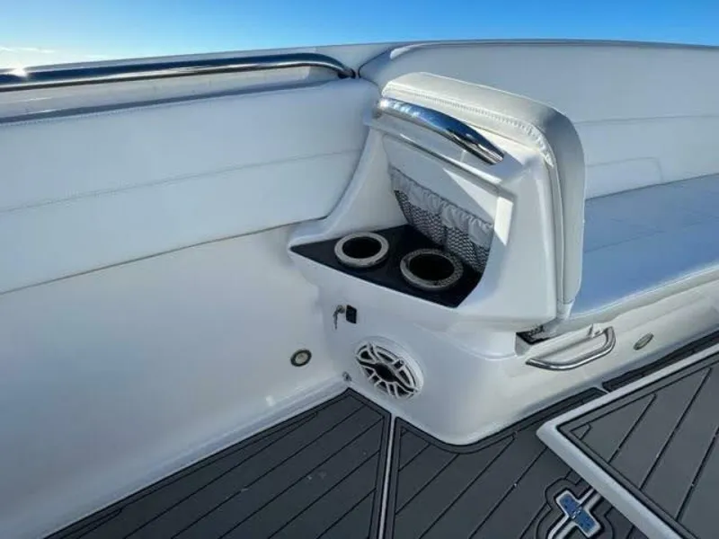 Slide: The Image of 2020 Nor-Tech Center Console boat interior with cup holders and speaker. - 4