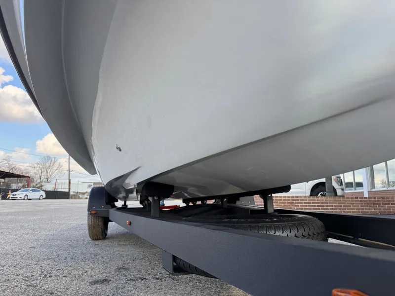 Slide: The Image of 2024 Chittum Skiffs 21 Mangrove boat on trailer, viewed from below. - 10
