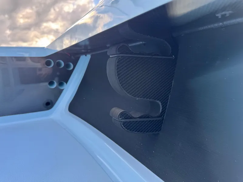 Slide: The Image of 2024 Chittum Skiffs 21 Mangrove interior detail with rod holder and sleek design. - 17