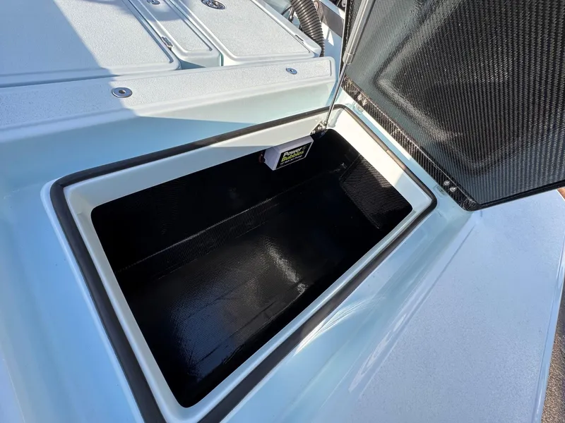 Slide: The Image of Open storage compartment of 2024 Chittum Skiffs 21 Mangrove boat. - 18