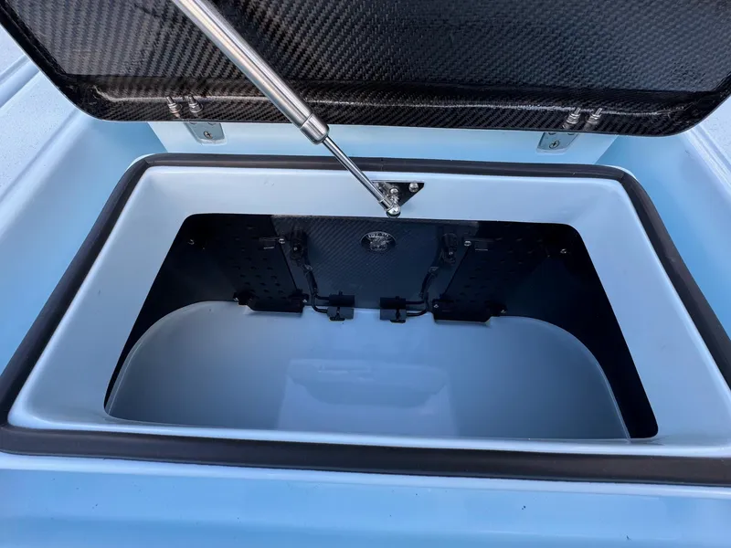 Slide: The Image of Open storage compartment of 2024 Chittum Skiffs 21 Mangrove boat. - 21