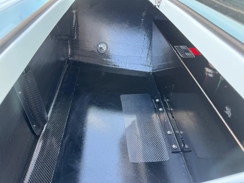 Slide: The Image of 2024 Chittum Skiffs 21 Mangrove storage compartment with sleek, durable interior design. - 23