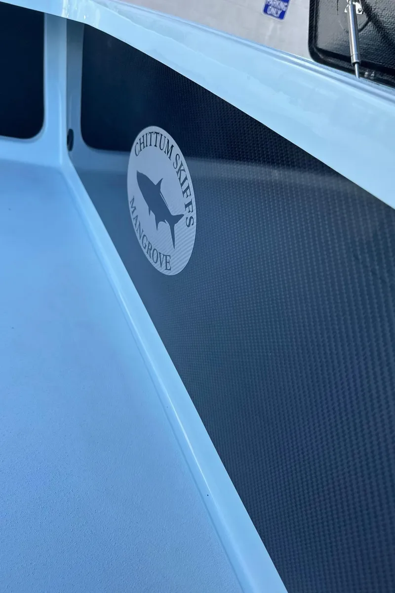 Slide: The Image of 2024 Chittum Skiffs 21 Mangrove boat interior with logo detail. - 25