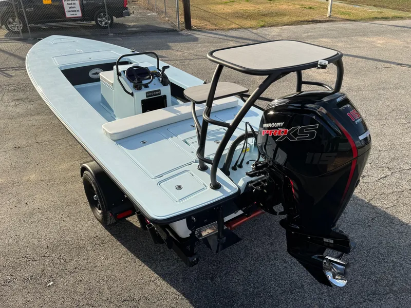 Slide: The Image of 2024 Chittum Skiffs 21 Mangrove boat with Mercury Pro XS engine on trailer. - 3