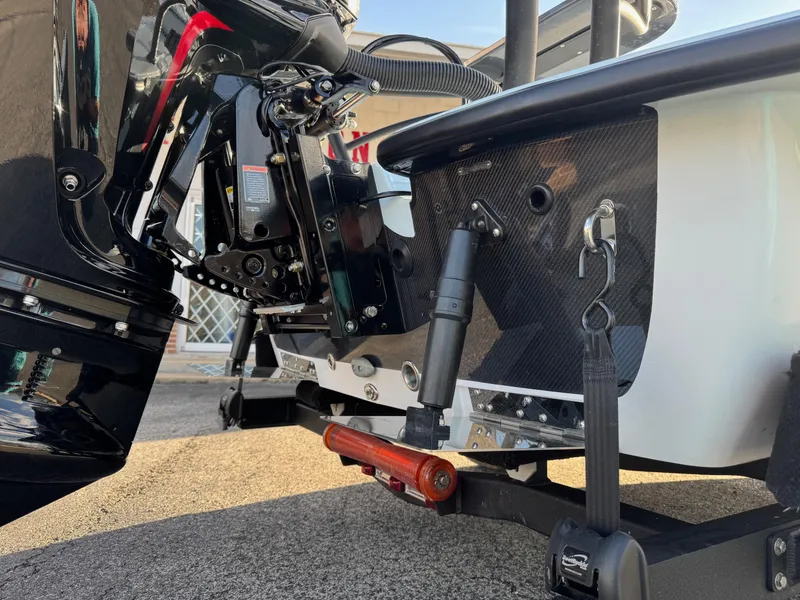 Slide: The Image of 2024 Chittum Skiffs 21 Mangrove boat with motor and trailer detail. - 5