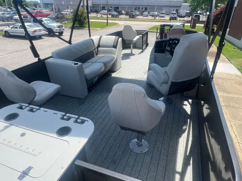 Slide: The Image of 2021 Sylvan Mirage Fish 8522 Party Fish 4.0 pontoon boat interior with seating and helm. - 14