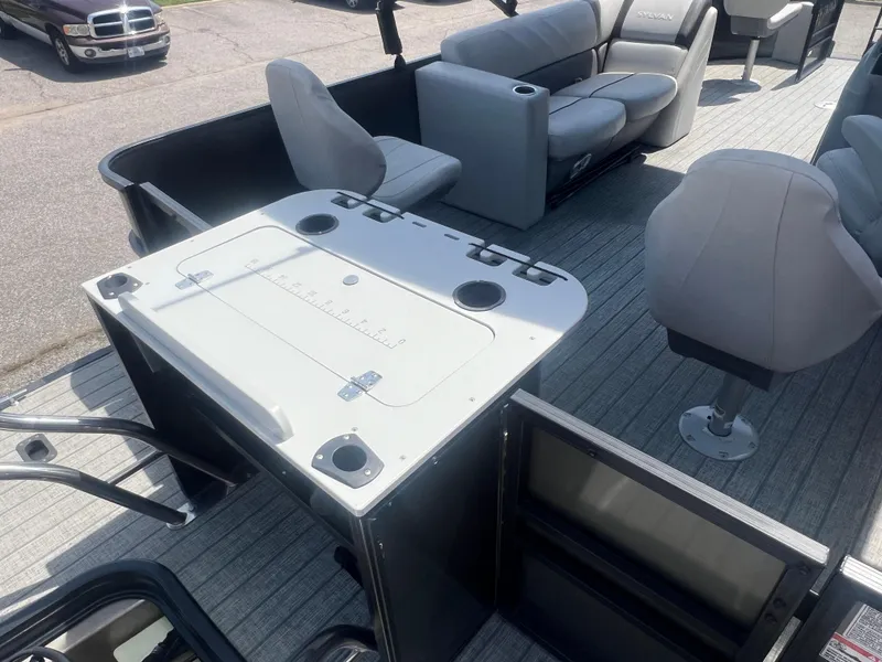 Slide: The Image of 2021 Sylvan Mirage Fish 8522 Party Fish 4.0 boat interior with seating and fishing station. - 15
