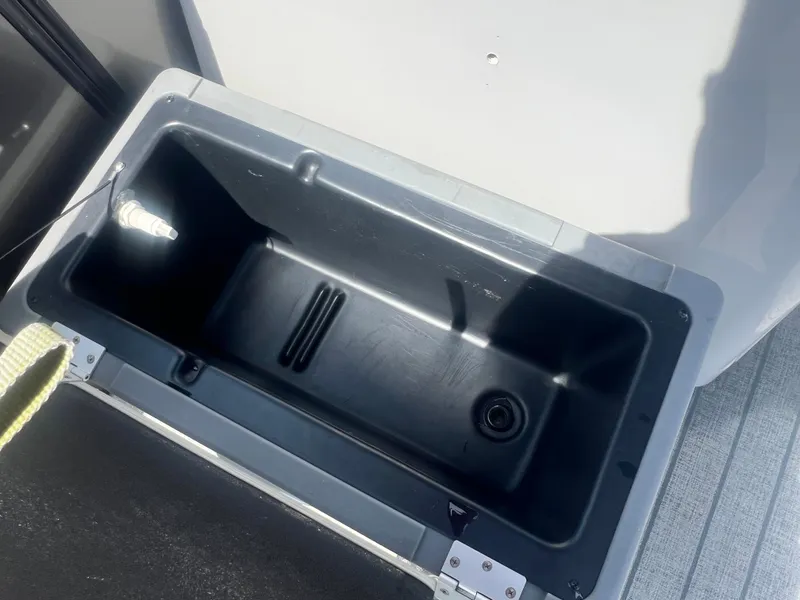 Slide: The Image of Open storage compartment on 2021 Sylvan Mirage Fish 8522 Party Fish 4.0 boat. - 24