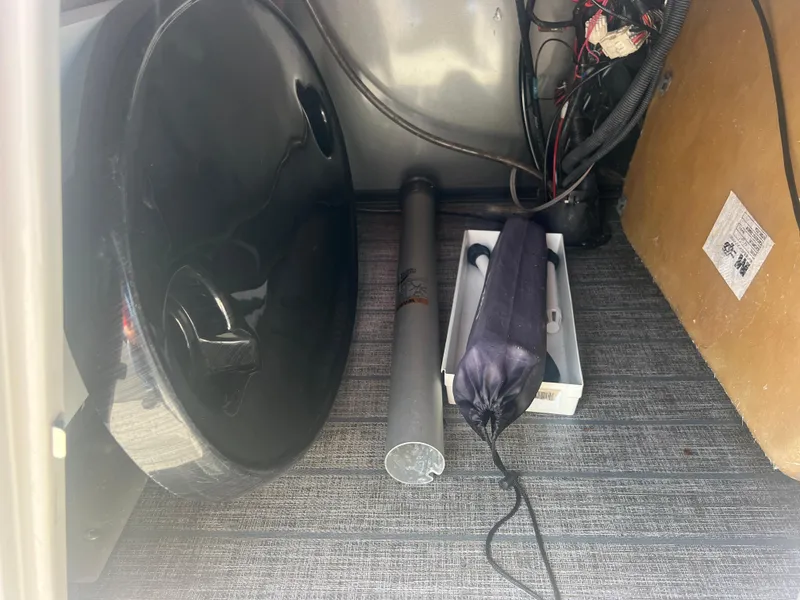 Slide: The Image of Storage compartment of 2021 Sylvan Mirage Fish 8522 with accessories and wiring. - 29