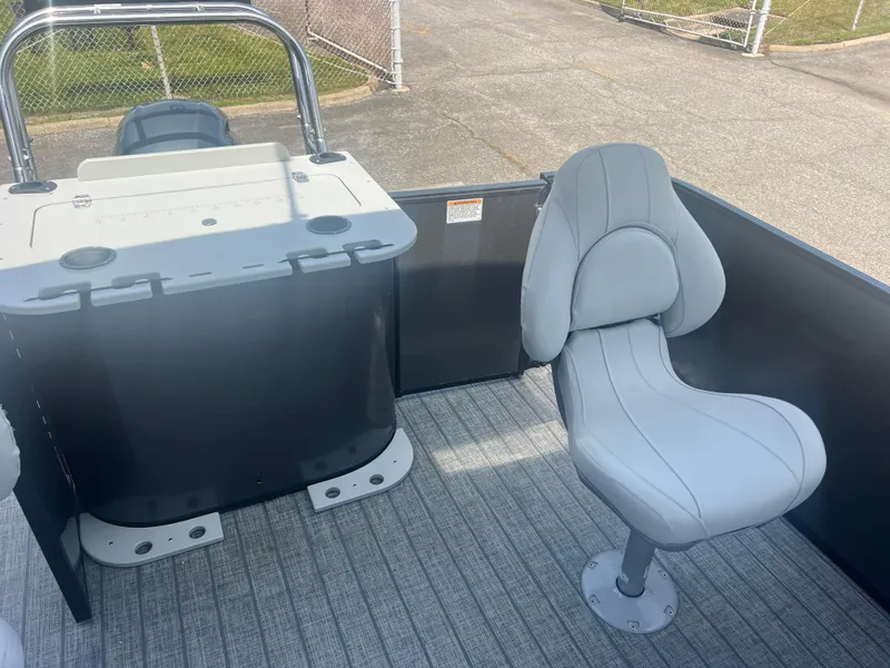 Slide: The Image of 2021 Sylvan Mirage Fish 8522 boat interior with a swivel seat and storage unit. - 30