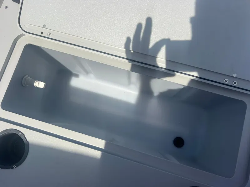 Slide: The Image of Open storage compartment on 2021 Sylvan Mirage Fish 8522 Party Fish 4.0 boat. - 31