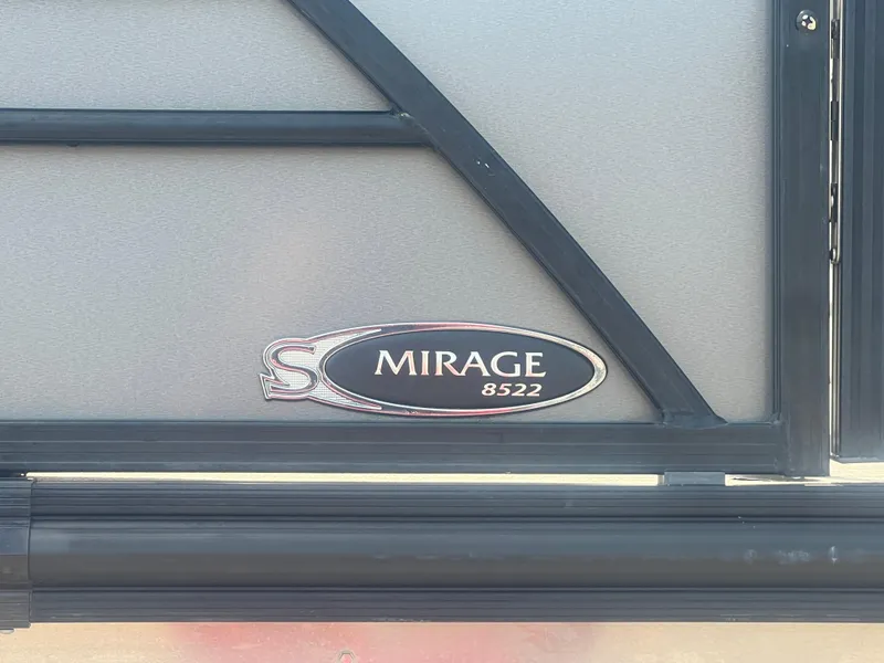 Slide: The Image of 2021 Sylvan Mirage Fish 8522 Party Fish 4.0 emblem on boat exterior. - 4