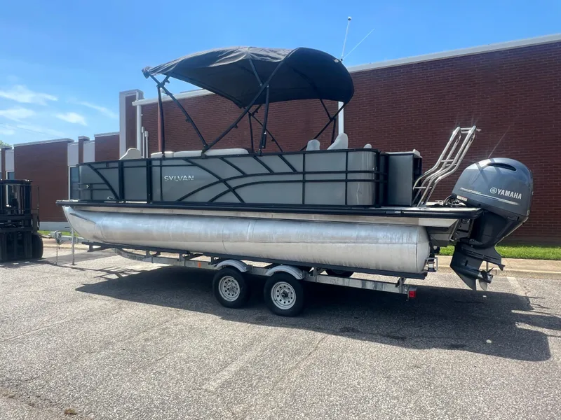 Slide: The Image of 2021 Sylvan Mirage Fish 8522 pontoon boat on trailer, with Yamaha outboard motor. - 5