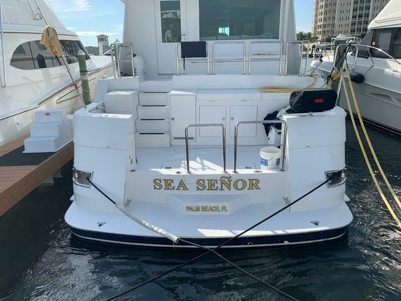 Slide: The Image of 1989 Hatteras Custom Cockpit yacht named "Sea Señor" docked in Palm Beach, Florida. - 10