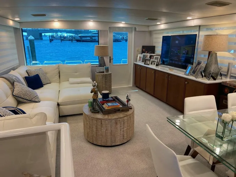 Slide: The Image of Luxurious interior of 1989 Hatteras Custom Cockpit yacht with modern furnishings and waterfront view. - 16