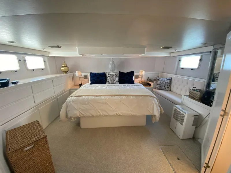Slide: The Image of Luxurious bedroom interior of 1989 Hatteras Custom Cockpit yacht with elegant decor and ample lighting. - 22