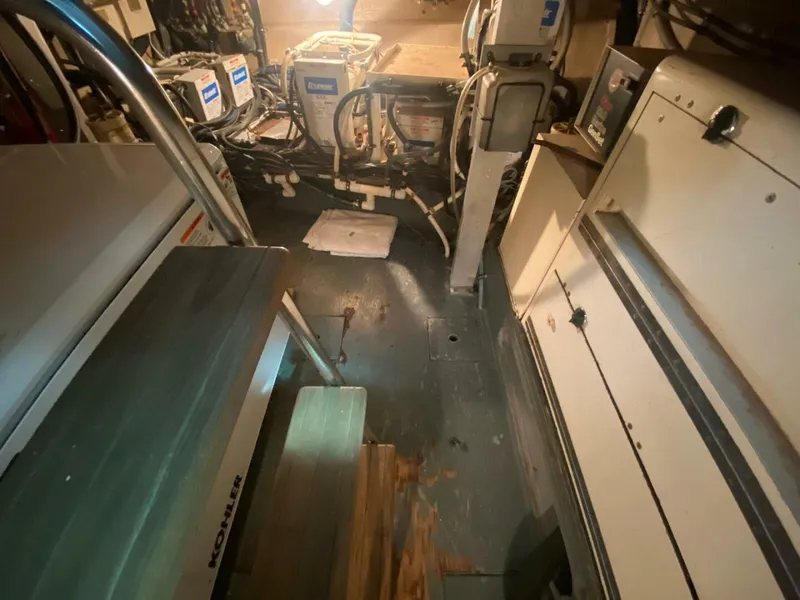 Slide: The Image of 1989 Hatteras Custom Cockpit engine room with equipment and wiring. - 37