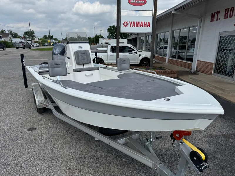 Slide: The Image of 2025 Avid 23 Fusion boat on trailer, parked outside dealership. - 5