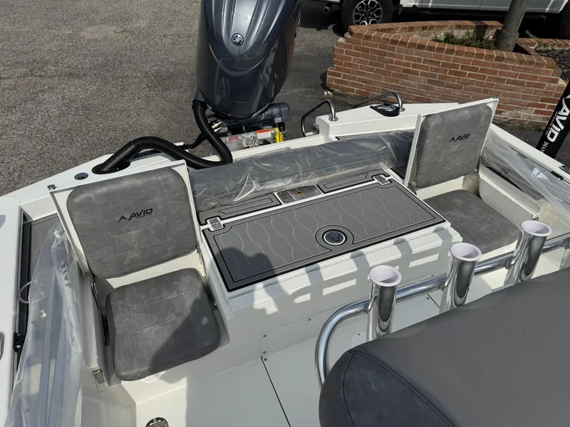 Slide: The Image of 2025 Avid 23 Fusion boat interior with seating and storage compartments. - 9