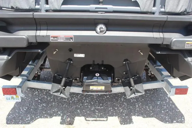 Slide: The Image of 2024 Sea-Doo Switch® Cruise 18 rear view, showcasing trailer and engine components. - 10