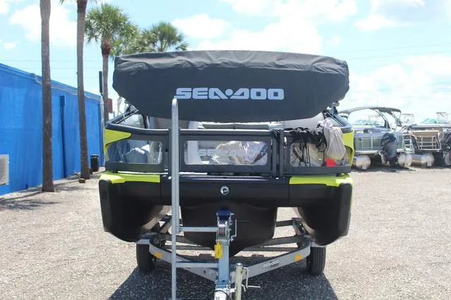 Slide: The Image of 2024 Sea-Doo Switch® Cruise 18 - 170 hp on trailer, rear view, outdoor setting. - 2