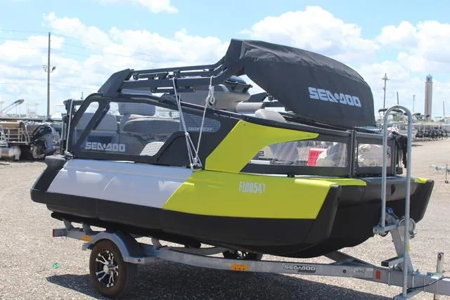 Slide: The Image of 2024 Sea-Doo Switch® Cruise 18 - 170 hp on trailer, vibrant design, outdoor setting. - 3