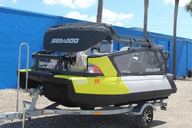Slide: The Image of 2024 Sea-Doo Switch® Cruise 18 - 170 hp on trailer, vibrant yellow and black design. - 7