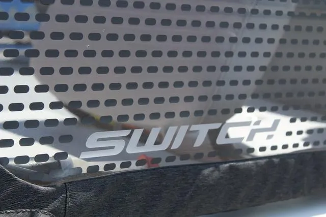 Slide: The Image of 2024 Sea-Doo Switch Cruise 18 logo on a perforated surface. - 9