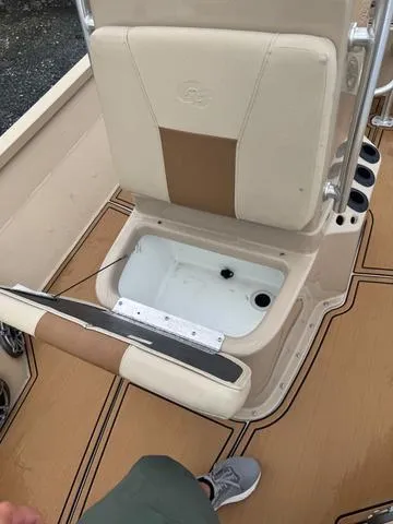 Slide: The Image of 2022 G3 BAY 22 DELUXE boat seat with storage compartment open. - 11