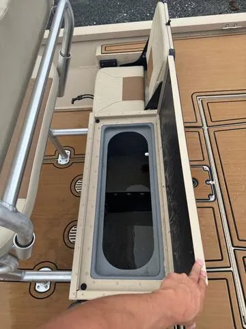 Slide: The Image of 2022 G3 BAY 22 DELUXE boat with open storage compartment on deck. - 12