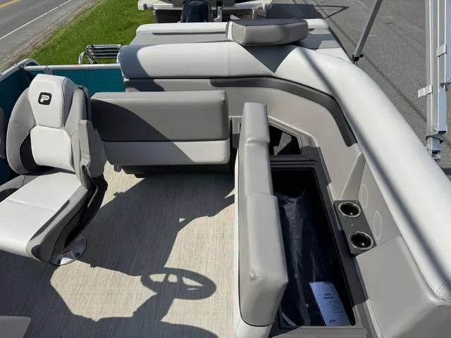 Slide: The Image of 2025 Princecraft Vectra 19 L 60HP boat cockpit with steering wheel and control panel. - 12