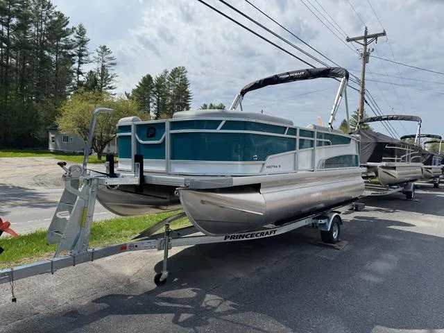 Slide: The Image of 2025 Princecraft Vectra 19 L 60HP pontoon boat on trailer, parked roadside. - 3