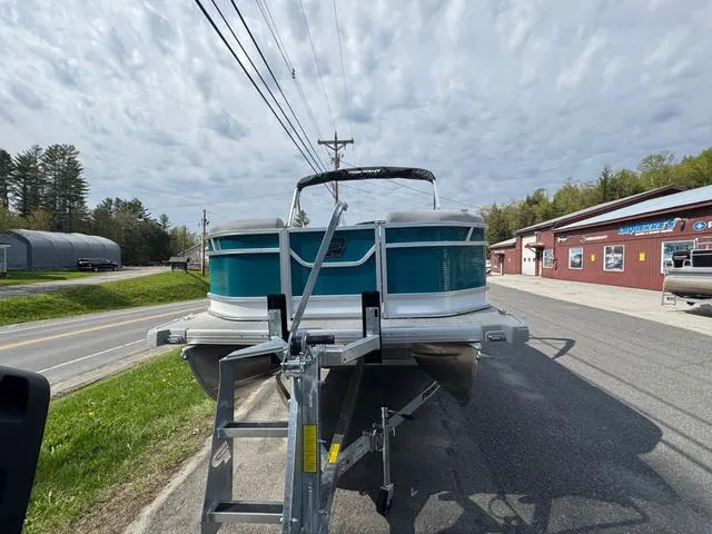 Slide: The Image of 2025 Princecraft Vectra 19 L 60HP pontoon boat on trailer, parked outdoors. - 4