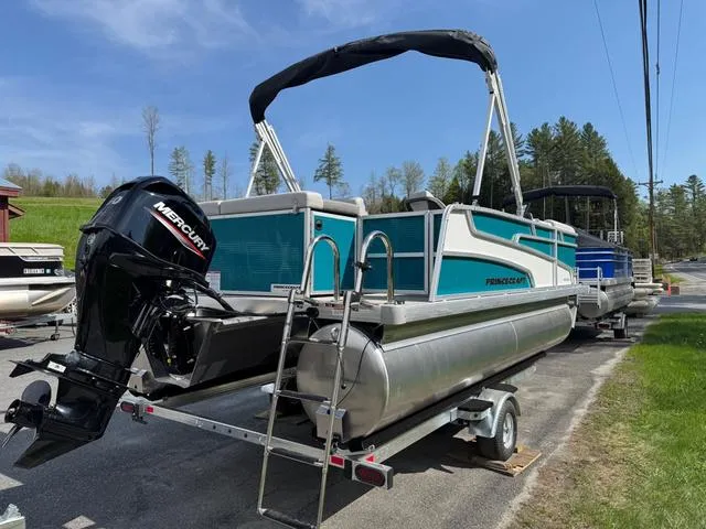 Slide: The Image of 2025 Princecraft Vectra 19 L pontoon boat with 60HP engine, parked on a trailer. - 6