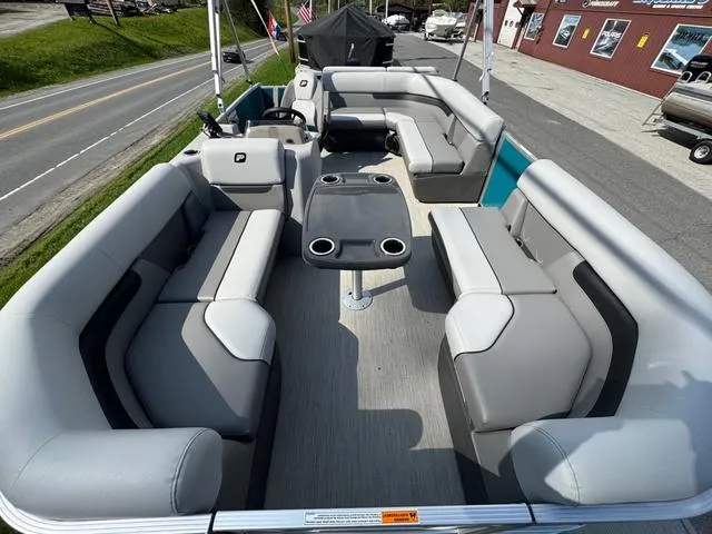 Slide: The Image of 2025 Princecraft Vectra 19 L 60HP pontoon boat interior with seating and table. - 9