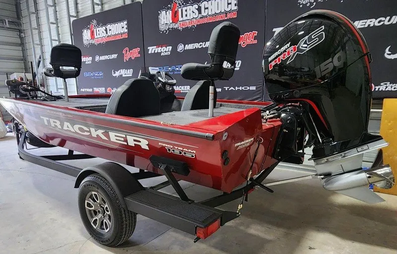 Slide: The Image of 2025 Tracker Pro Team™ 195 Tournament Edition boat with powerful engine in showroom. - 10