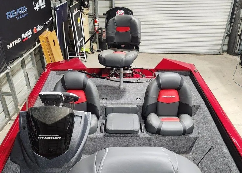 Slide: The Image of 2025 Tracker Pro Team™ 195 Tournament Edition boat interior with seating and console. - 3