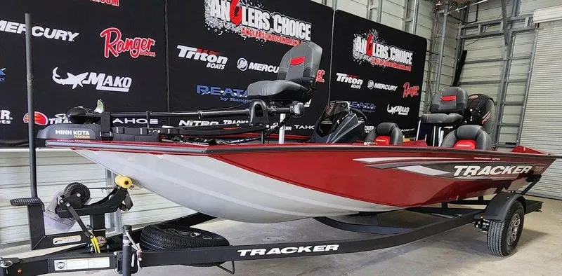 Slide: The Image of 2025 Tracker Pro Team™ 195 Tournament Edition boat in showroom, red and white design. - 9