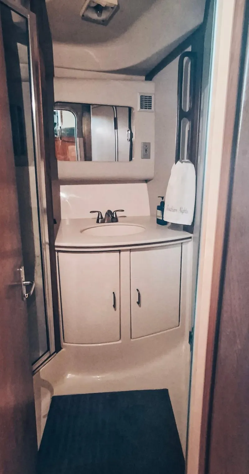 Slide: The Image of Bathroom interior of 1993 Luhrs 350 Tournament boat with sink and mirror. - 10