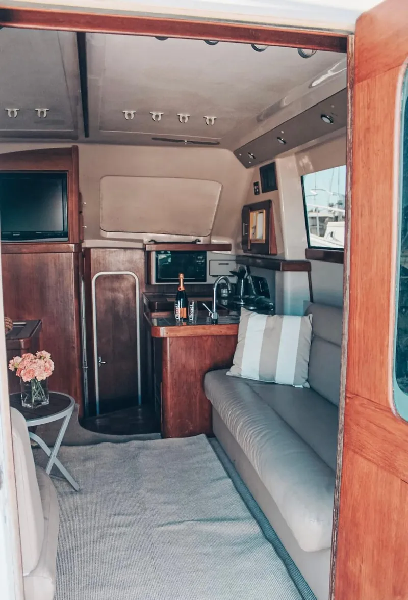 Slide: The Image of Interior of 1993 Luhrs 350 Tournament yacht with cozy seating and modern amenities. - 16